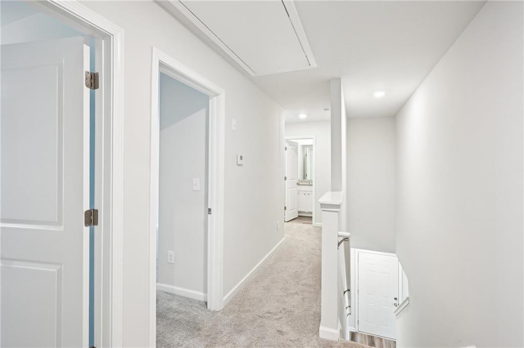 4437 Ben Hill Road Atlanta, GA 30349 - Photo 13 of 40 a bathroom with a glass shower door
