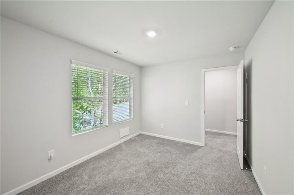 4437 Ben Hill Road Atlanta, GA 30349 - Photo 24 of 40 an empty room with windows