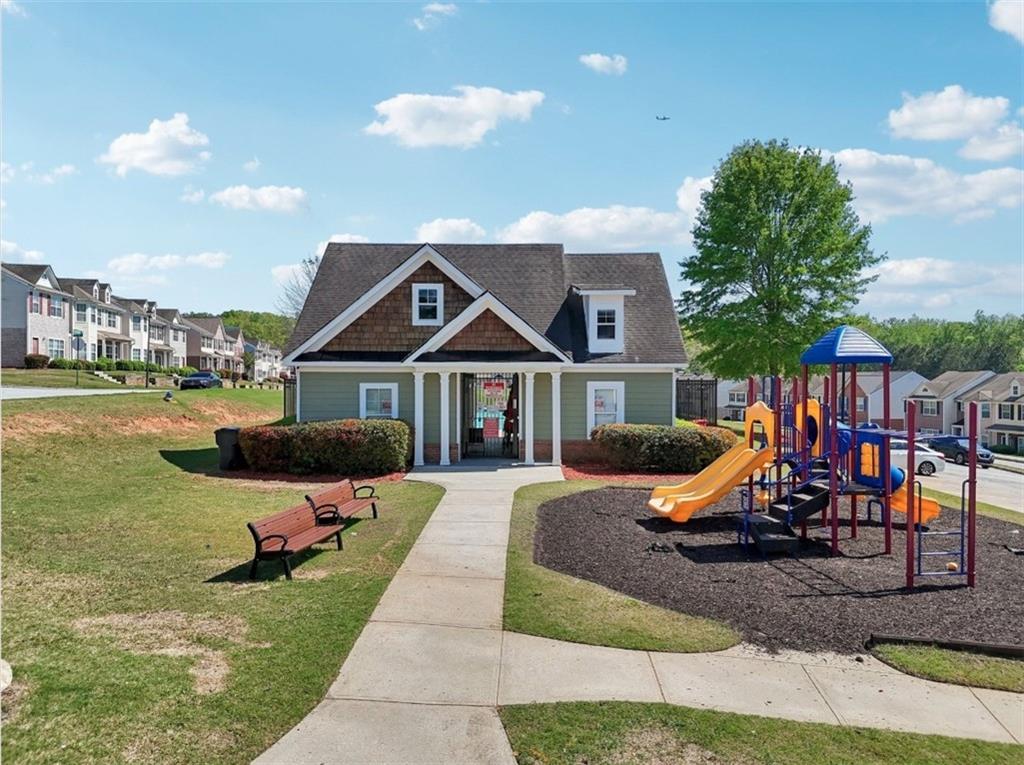 4437 Ben Hill Road Atlanta, GA 30349 - Photo 39 of 40 a front view of a house with a yard
