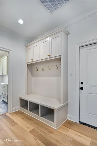 a large bathroom with a double vanity sink toilet mirror and bathtub