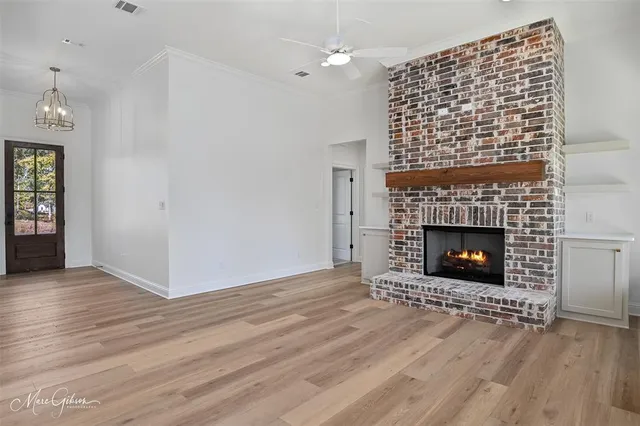 a kitchen with white cabinets and sink