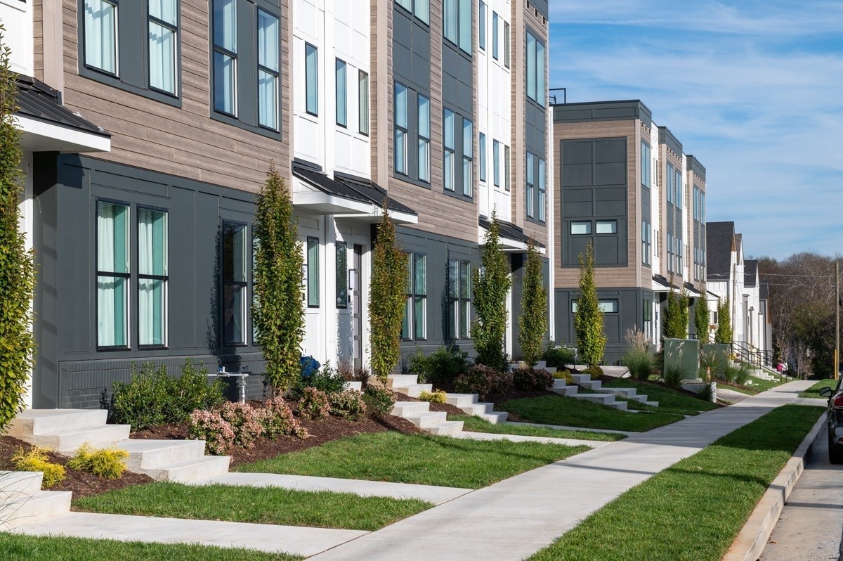 97 Lucile Street Nashville, TN 37207 - Photo 1 of 27 a front view of a brick building with yard and fountain in front of it