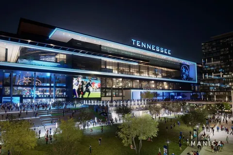 an aerial view of a house with a garden and lake view