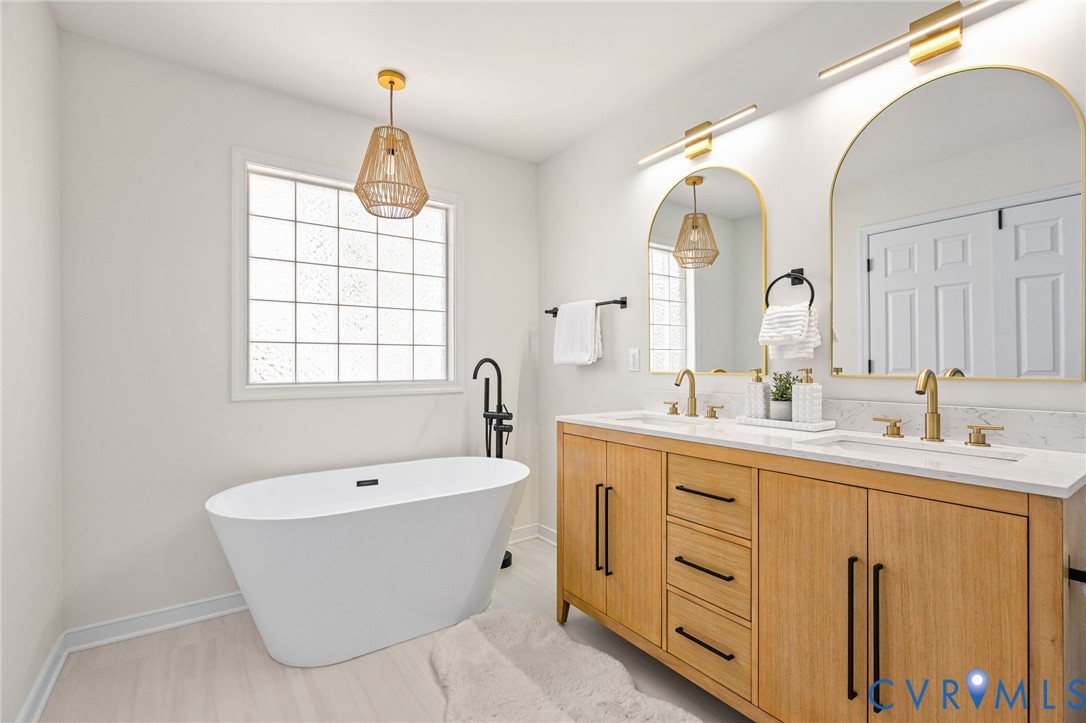 14200 Princess Mary Road Chesterfield, VA 23838 - Photo 46 of 83 a spacious bathroom with a double vanity sink mirror and bathtub