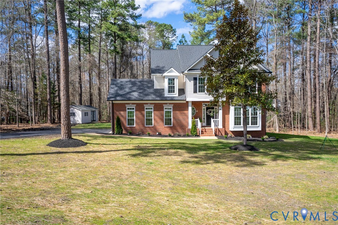 14200 Princess Mary Road Chesterfield, VA 23838 - Photo 5 of 83 a view of a house with a yard and sitting area