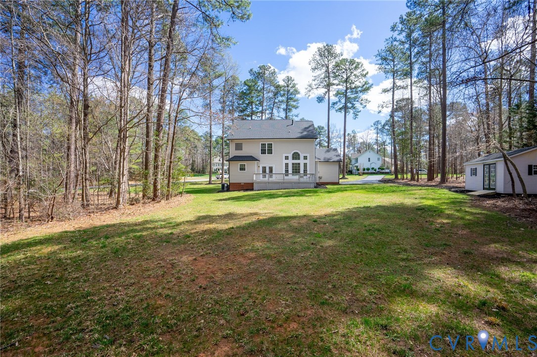 14200 Princess Mary Road Chesterfield, VA 23838 - Photo 59 of 83 a view of a house with a big yard and large trees