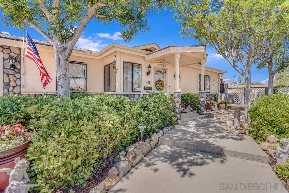 9468 Domer Road Santee, CA 92071 - Photo 1 of 25 a view of a white house with a yard and potted plants