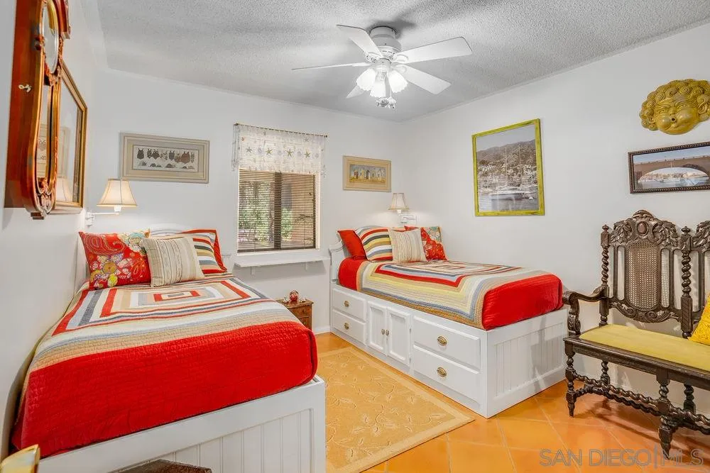 9468 Domer Road Santee, CA 92071 - Photo 15 of 25 a bedroom with a bed and a chandelier