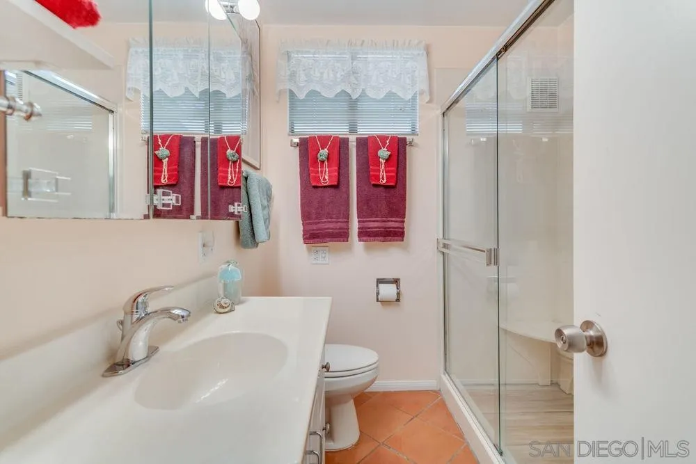 9468 Domer Road Santee, CA 92071 - Photo 17 of 25 a bathroom with a sink and a toilet