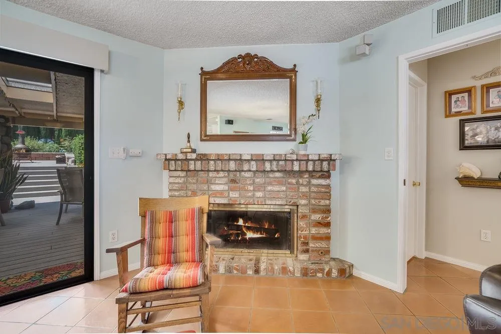 9468 Domer Road Santee, CA 92071 - Photo 5 of 25 a living room with furniture and a fireplace