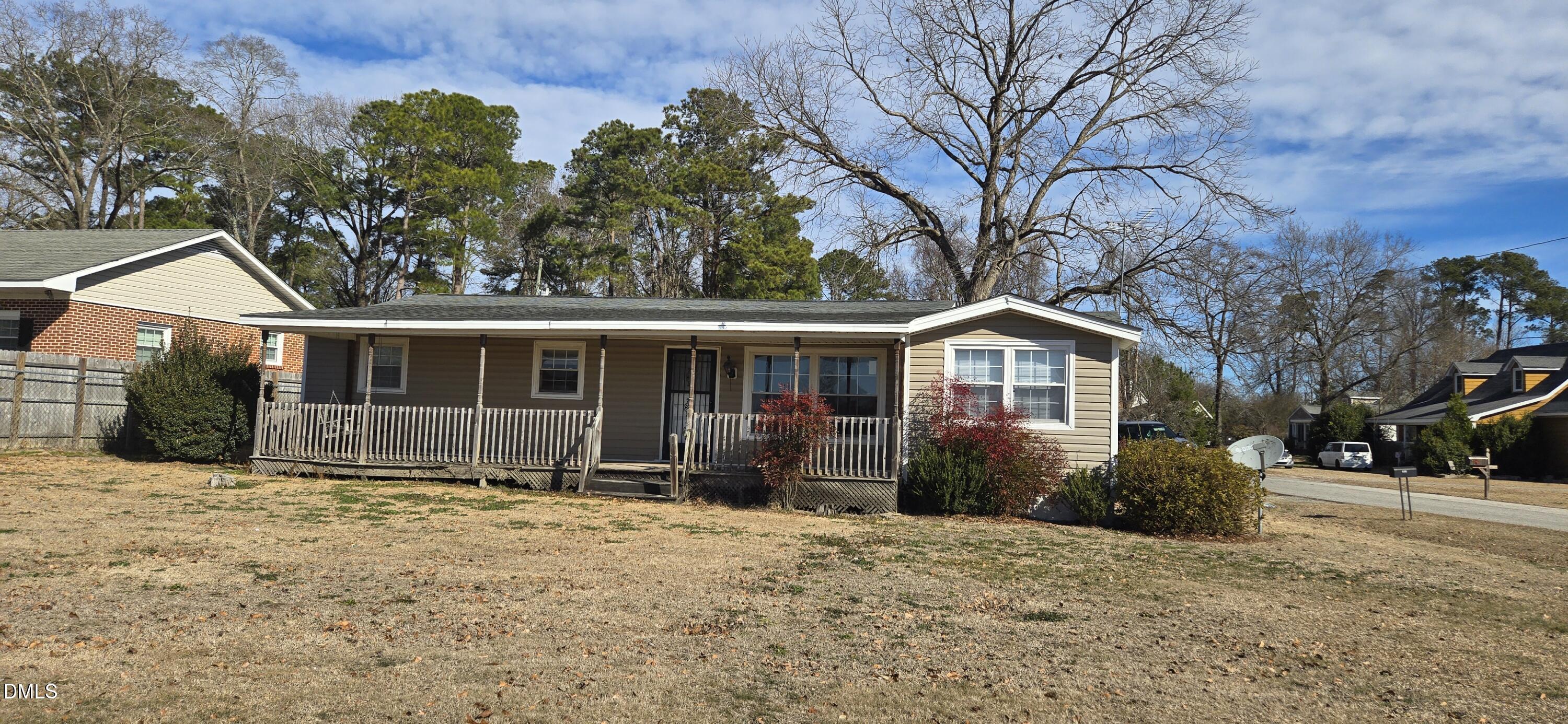 480 5 Bridge Road Clinton, NC 28328 - Photo 1 of 23 a front view of a house with a yard and garage