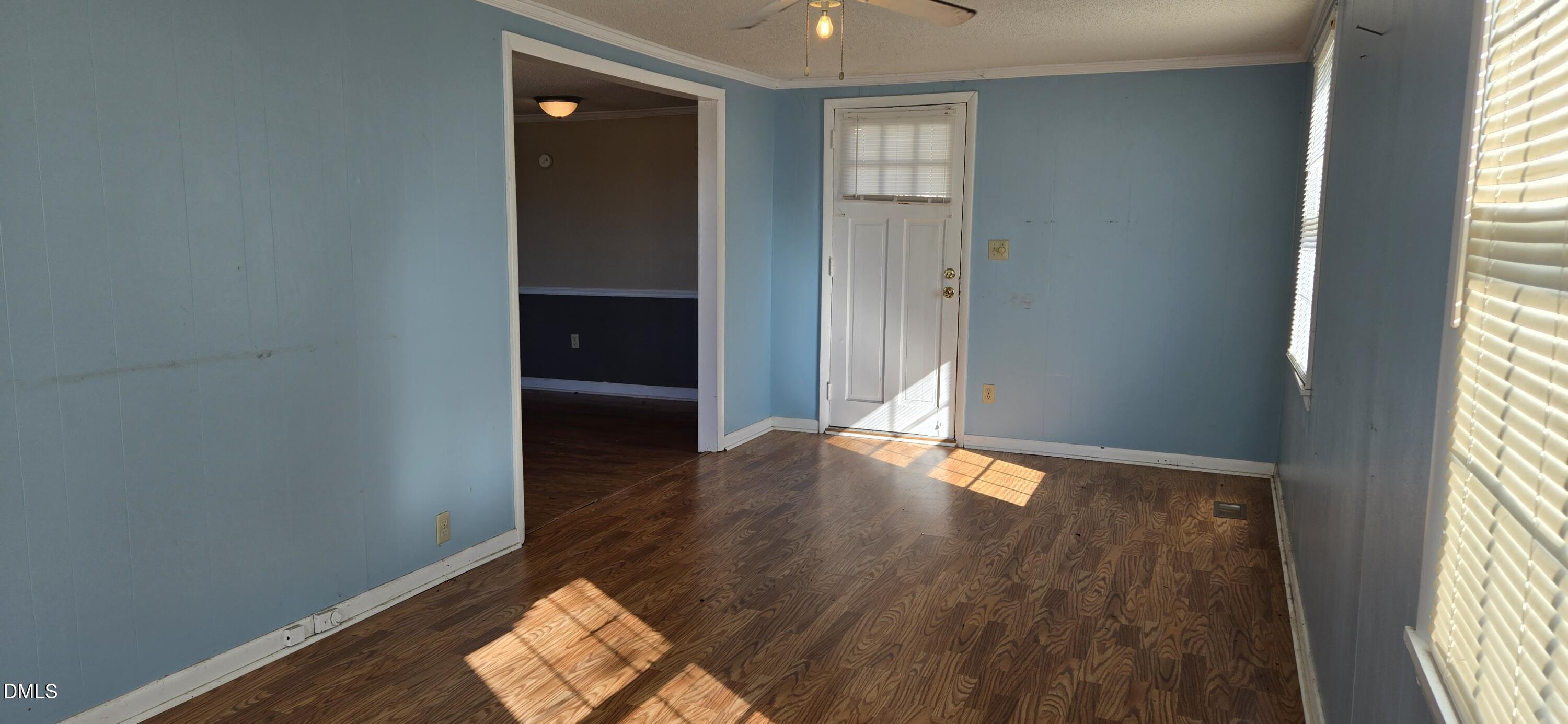 480 5 Bridge Road Clinton, NC 28328 - Photo 11 of 23 an empty room with wooden floor and windows