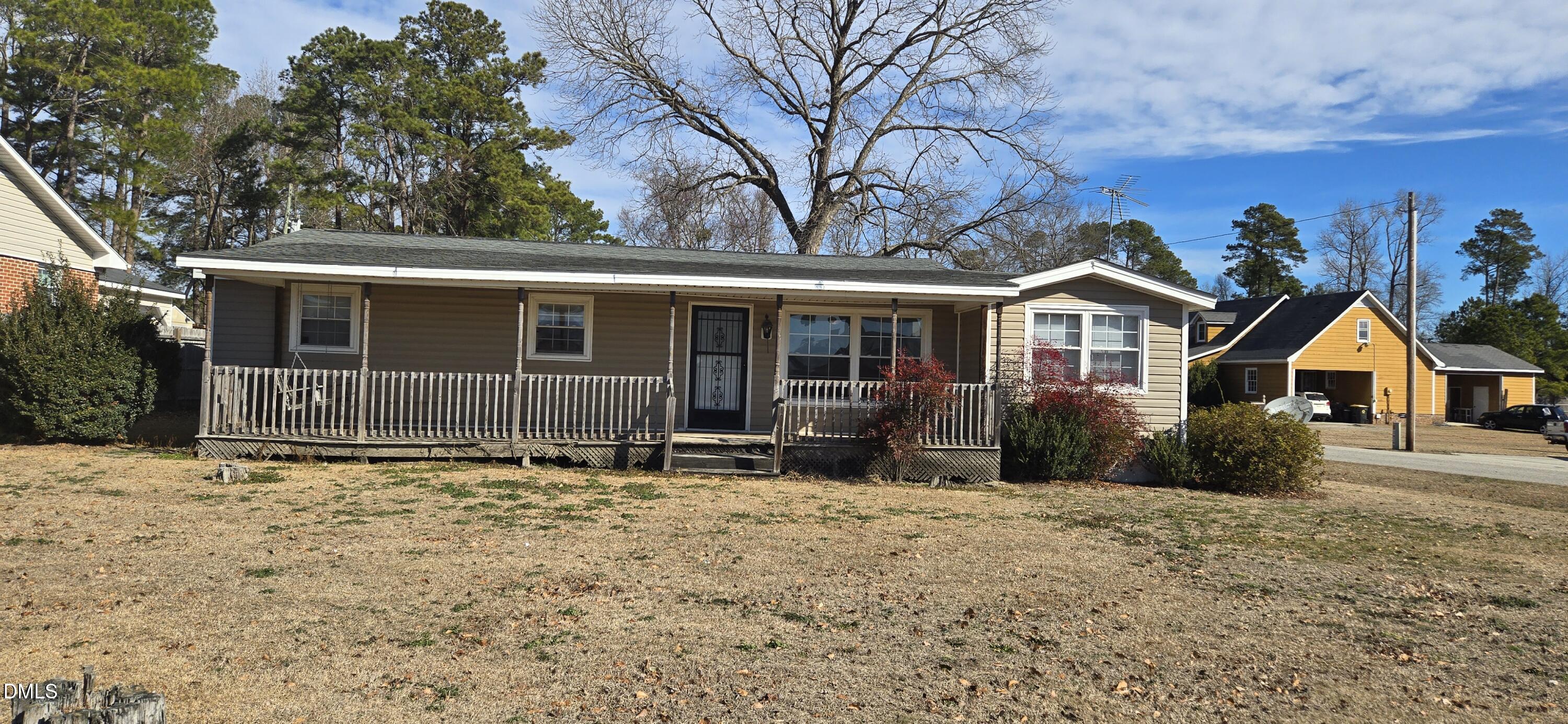 480 5 Bridge Road Clinton, NC 28328 - Photo 23 of 23 a front view of a house with yard and seating area