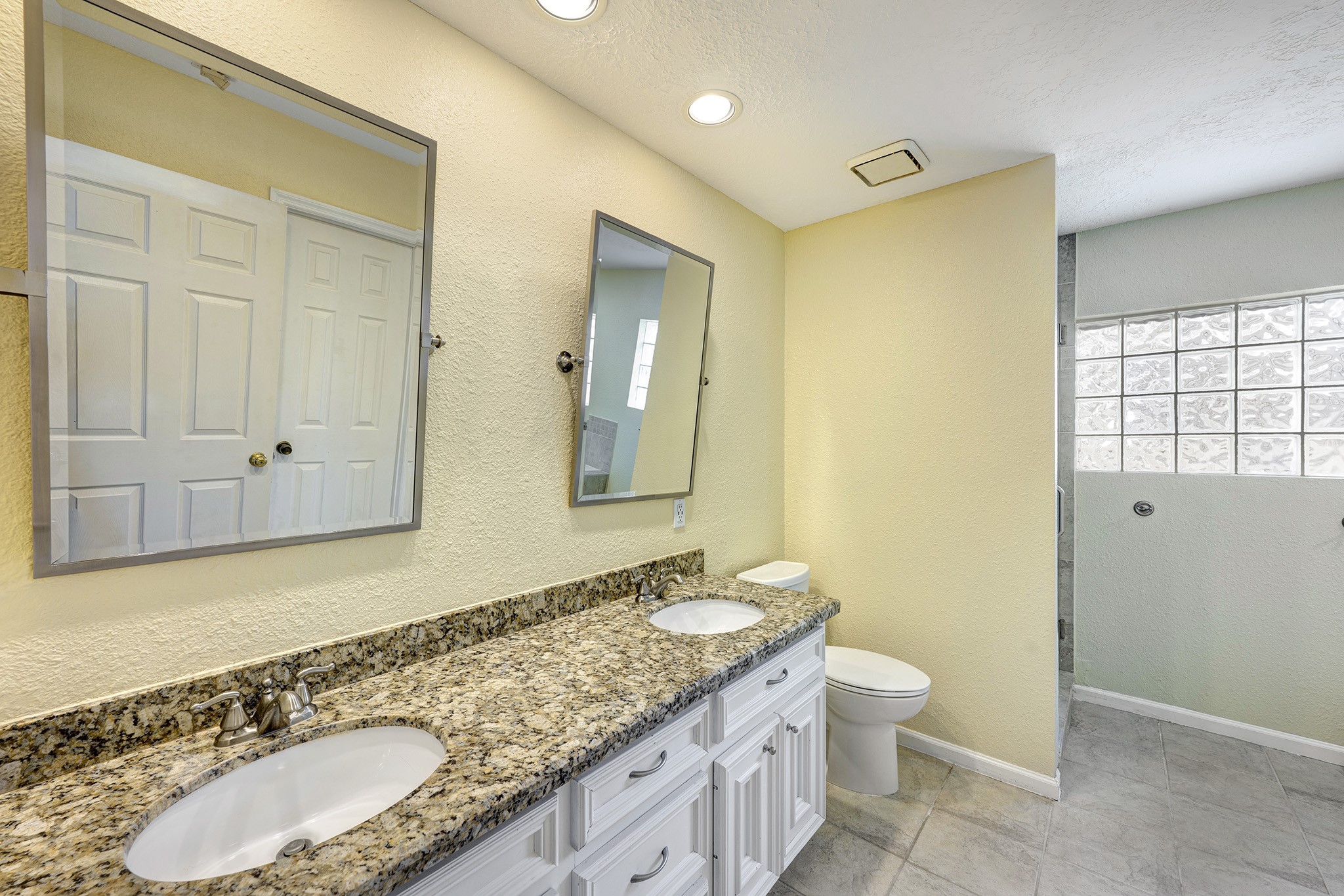 10222 Crooks Way Court Houston, TX 77065 - Photo 11 of 27 Primary bath featuring dual sinks and a walk-in shower.