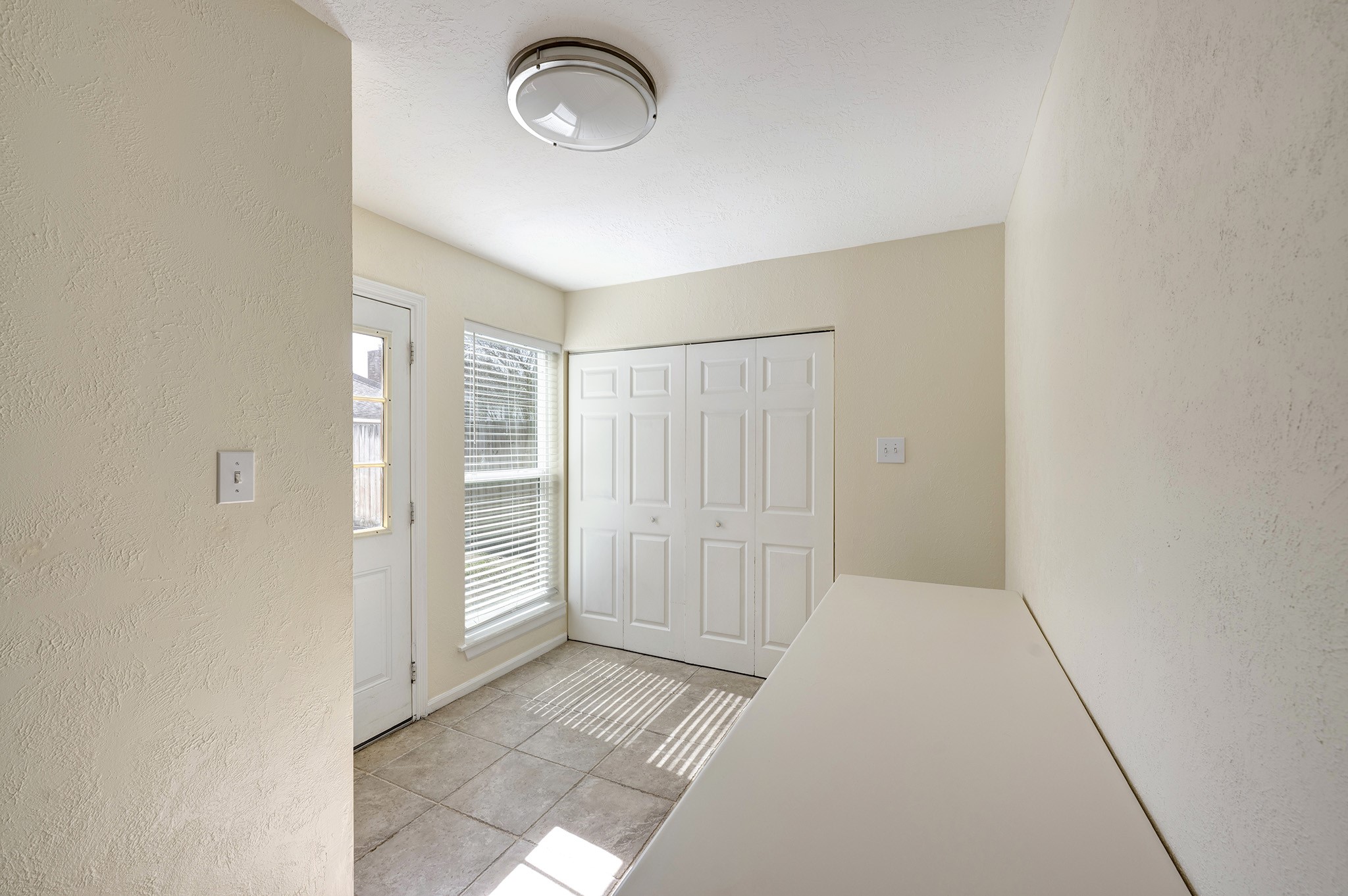 10222 Crooks Way Court Houston, TX 77065 - Photo 8 of 27 Versatile laundry room and flex space off the garage with convenient access to the backyard.
