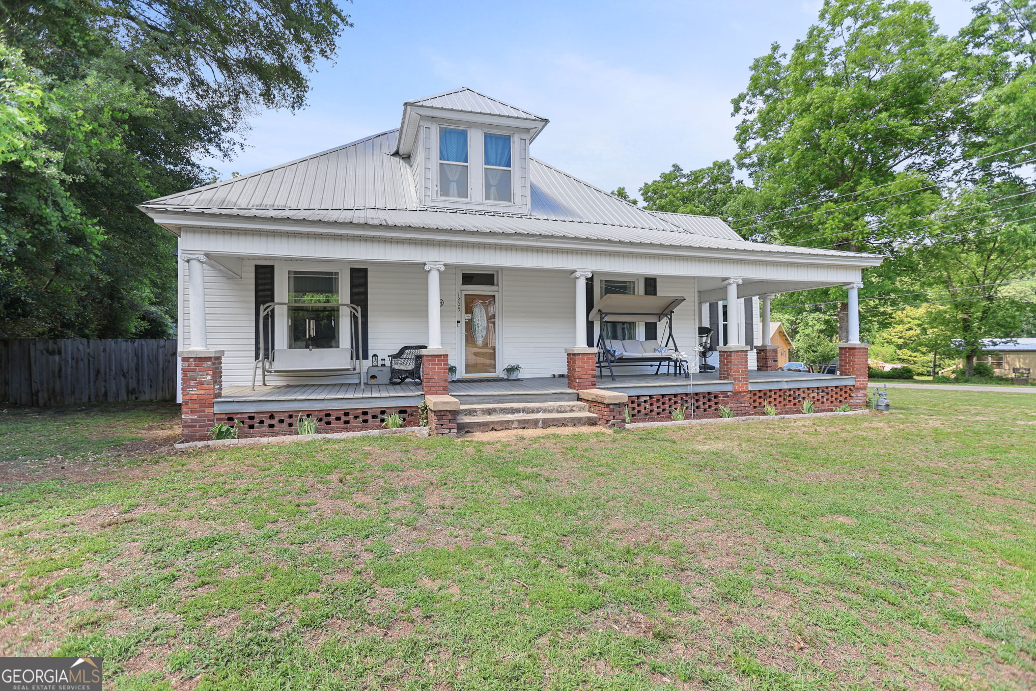 1205 Terrell Street Greenville, GA 30222 - Photo 4 of 50 a view of a house with a backyard porch and sitting area
