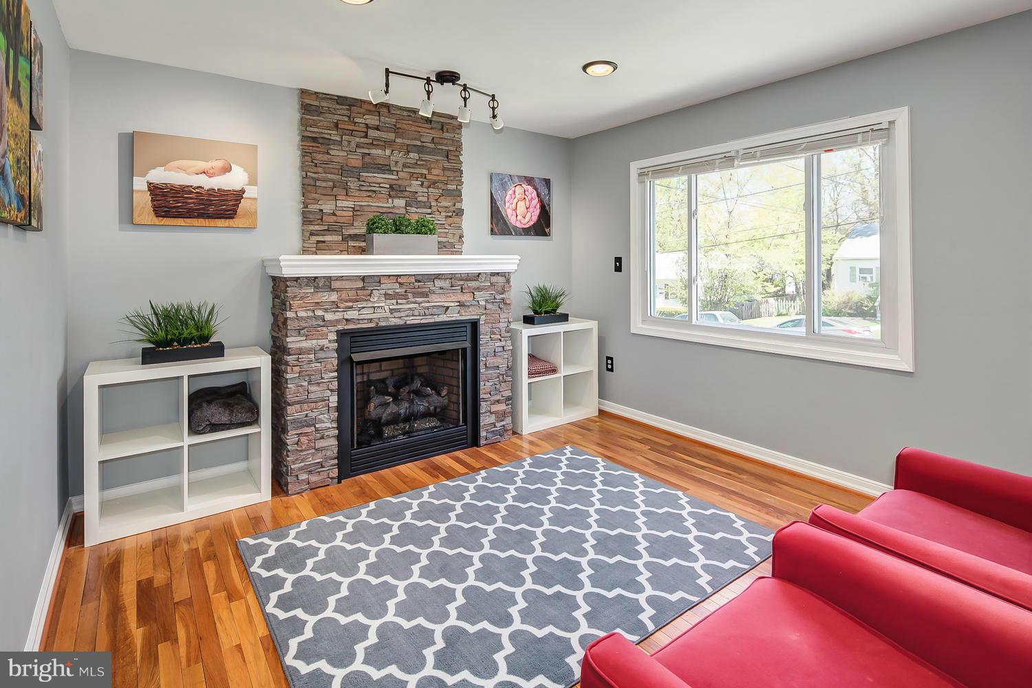 12304 Middle Road Silver Spring, MD 20906 - Photo 2 of 30 a bedroom with a bed and a fireplace