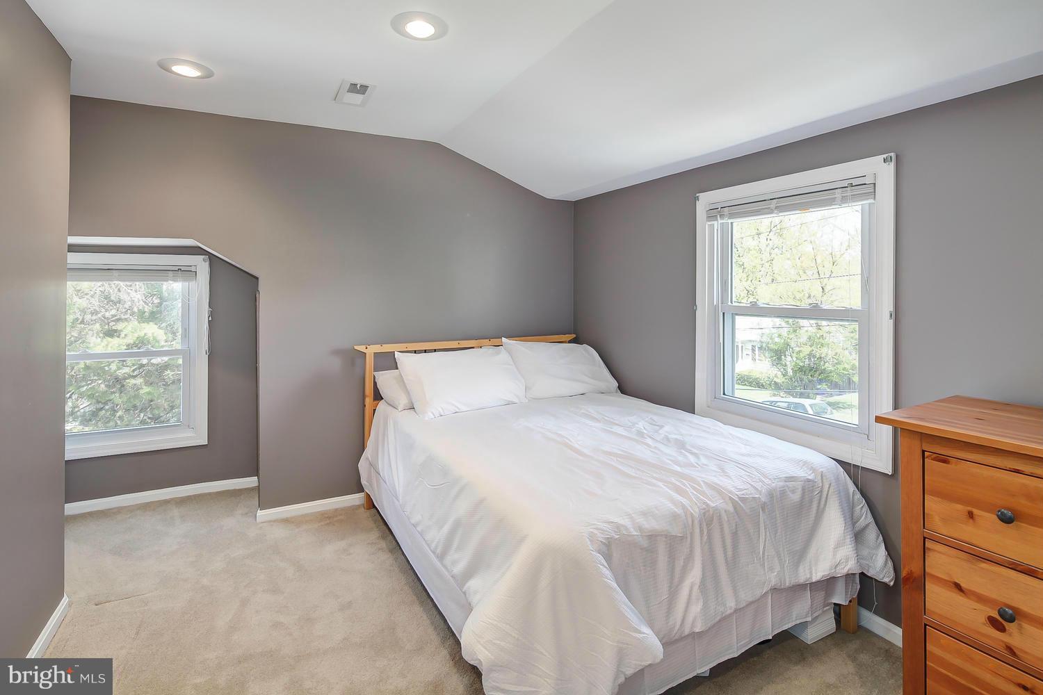 12304 Middle Road Silver Spring, MD 20906 - Photo 14 of 30 a bedroom with a bed and a window