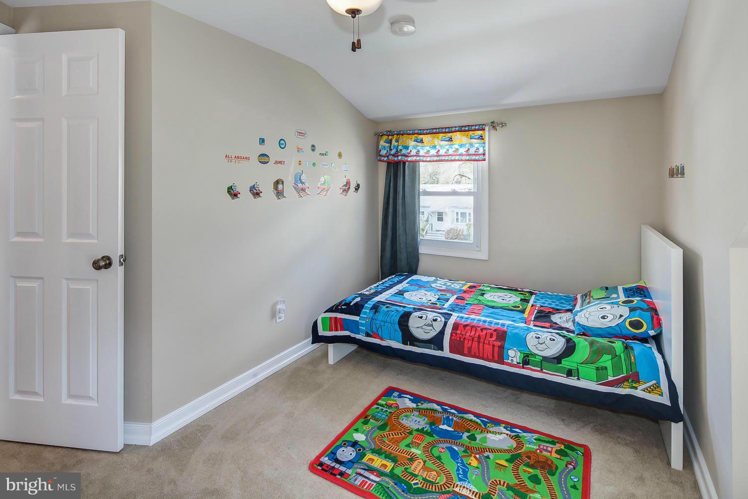 12304 Middle Road Silver Spring, MD 20906 - Photo 18 of 30 a bedroom with a bed and a window