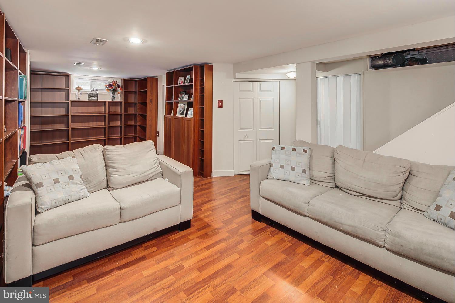 12304 Middle Road Silver Spring, MD 20906 - Photo 20 of 30 a living room with furniture and walk in closet