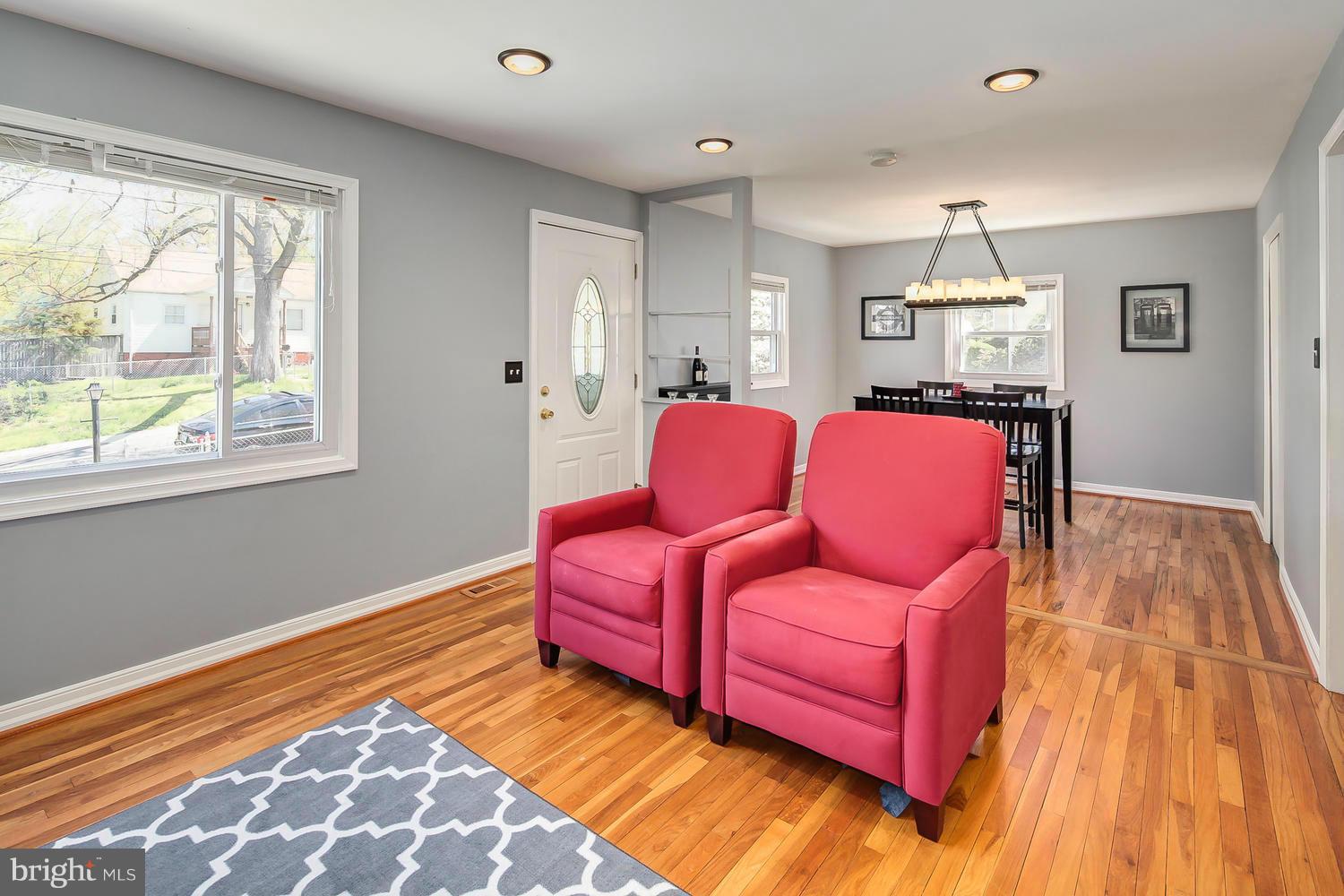12304 Middle Road Silver Spring, MD 20906 - Photo 3 of 30 a living room with furniture and a wooden floor