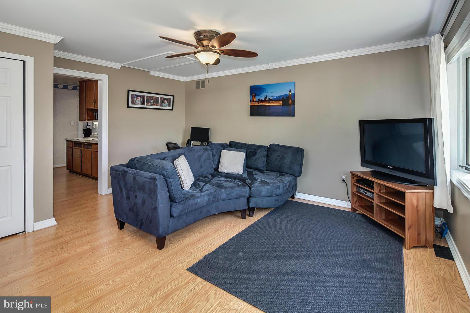 12304 Middle Road Silver Spring, MD 20906 - Photo 23 of 30 a living room with furniture and a flat screen tv