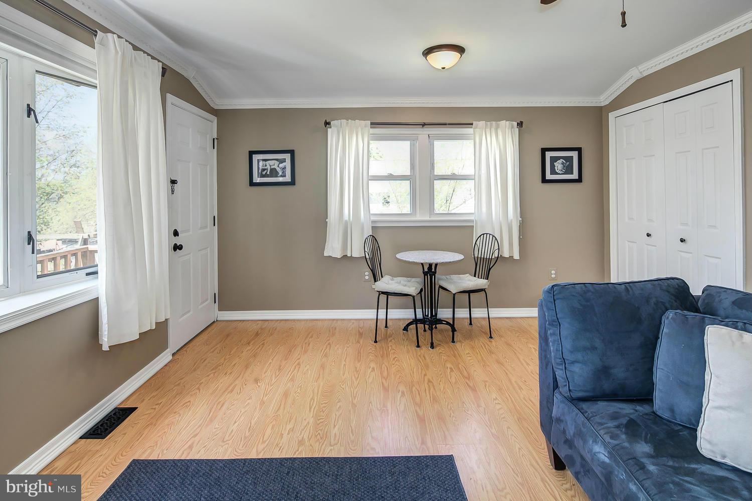 12304 Middle Road Silver Spring, MD 20906 - Photo 24 of 30 a living room with furniture and a wooden floor