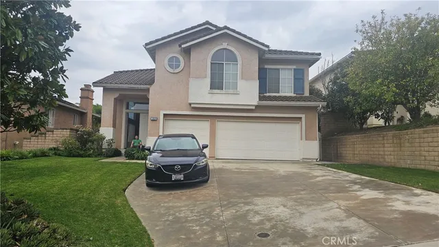 a house view with a garden space