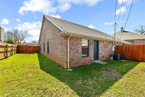 a view of a house with a yard and garage