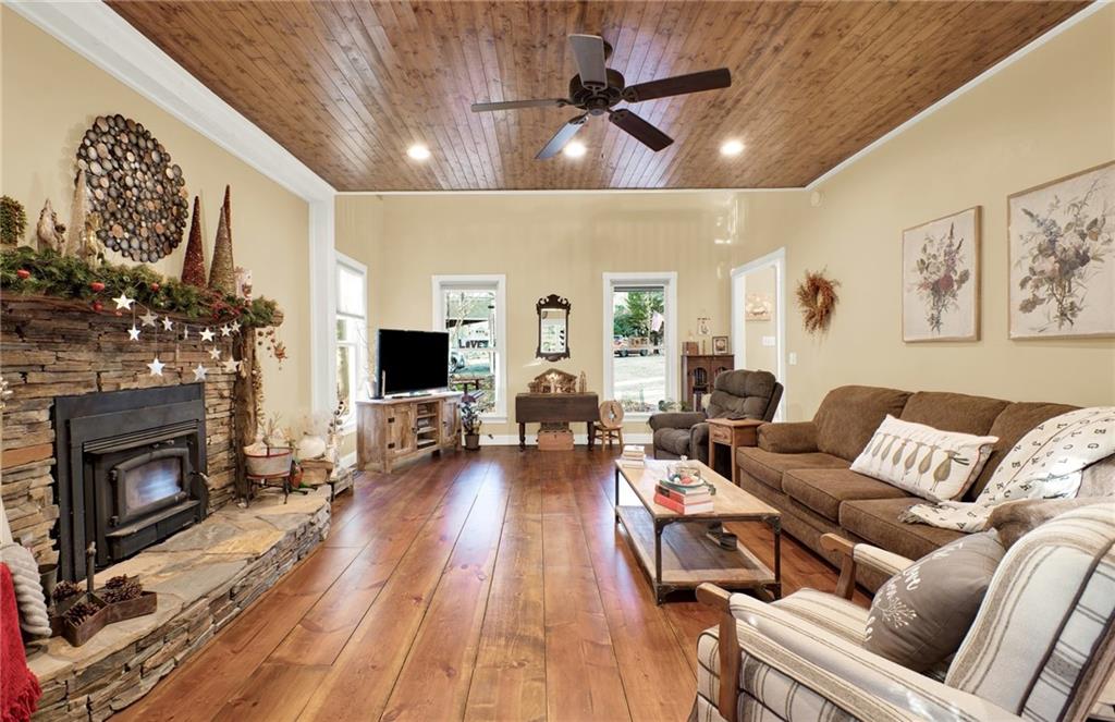 1050 Robinson Road Dahlonega, GA 30533 - Photo 12 of 28 a living room with furniture fireplace and wooden floor