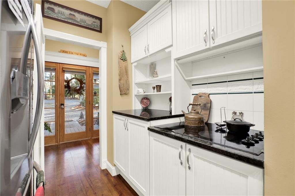 1050 Robinson Road Dahlonega, GA 30533 - Photo 15 of 28 a kitchen with stainless steel appliances granite countertop a sink and cabinets