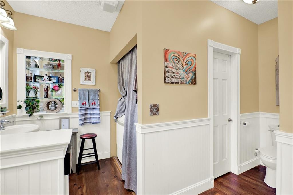 1050 Robinson Road Dahlonega, GA 30533 - Photo 16 of 28 a view of a hallway with wooden floor and furniture