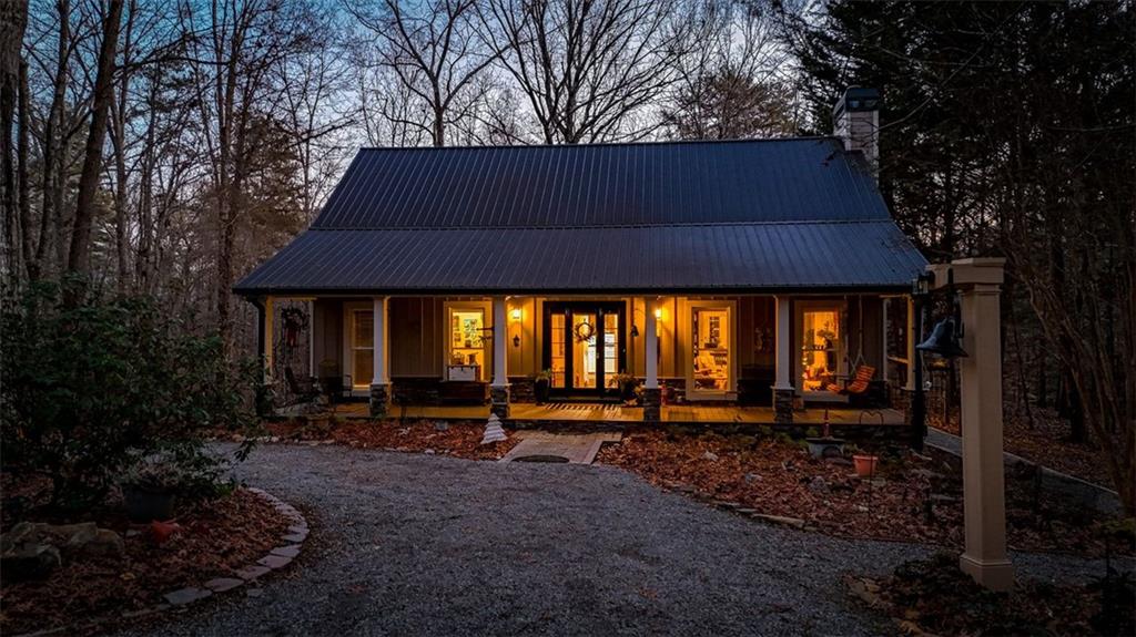 1050 Robinson Road Dahlonega, GA 30533 - Photo 2 of 28 a front view of a house with garden