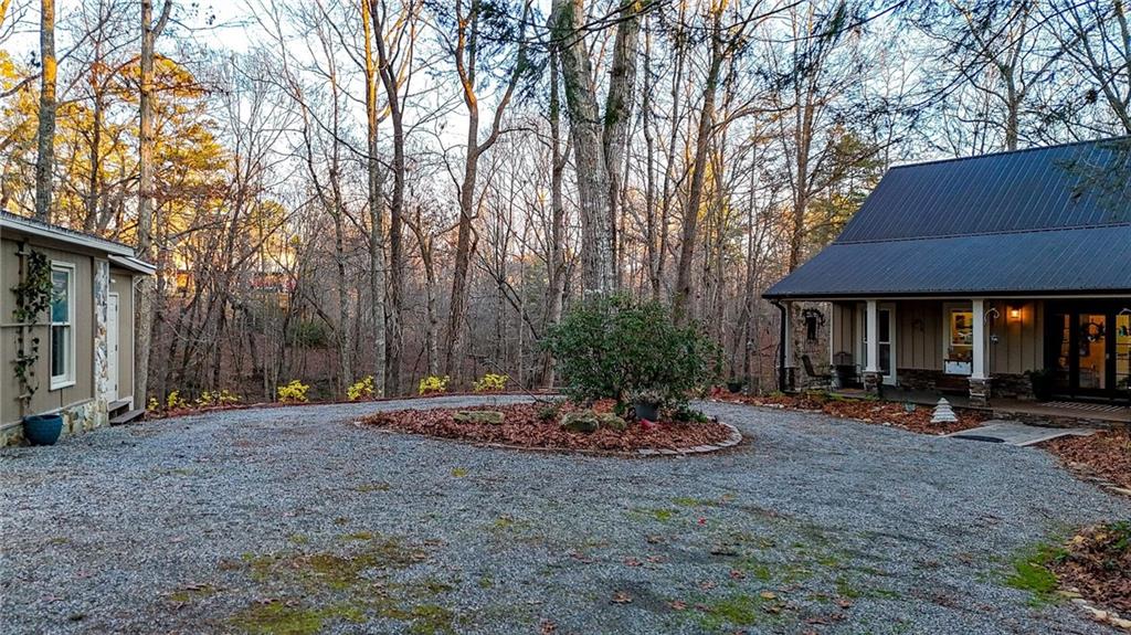 1050 Robinson Road Dahlonega, GA 30533 - Photo 24 of 28 a view of a patio with table and chairs under an umbrella
