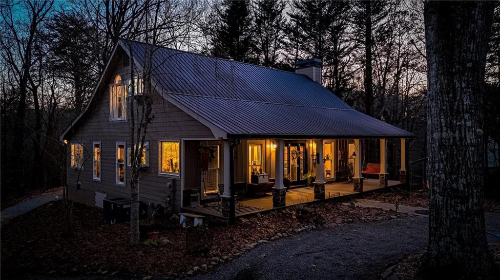 1050 Robinson Road Dahlonega, GA 30533 - Photo 25 of 28 a backyard of a house with barbeque oven table and chairs