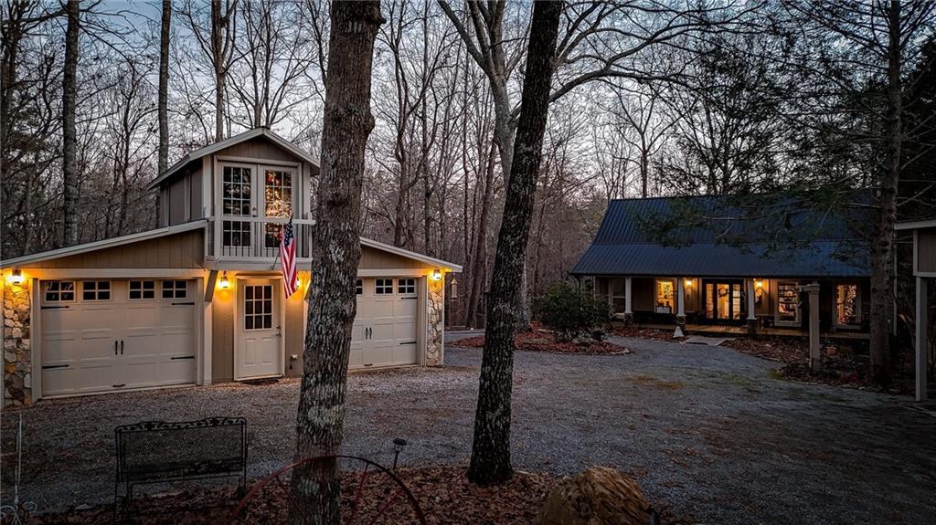1050 Robinson Road Dahlonega, GA 30533 - Photo 27 of 28 a front view of a house with a yard and garage