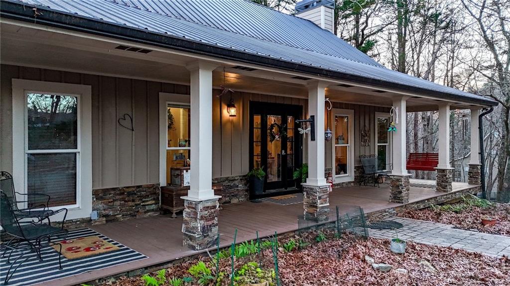1050 Robinson Road Dahlonega, GA 30533 - Photo 5 of 28 a front view of a house with patio