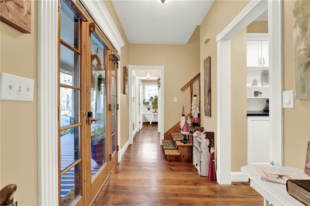 1050 Robinson Road Dahlonega, GA 30533 - Photo 10 of 28 a view of a hallway with wooden floor and windows