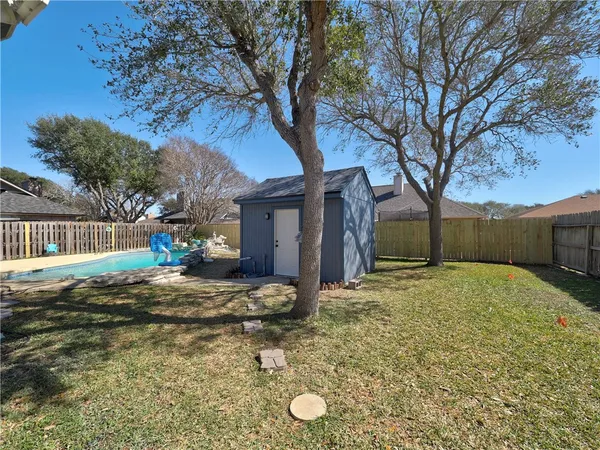 a front view of house with yard and outdoor seating