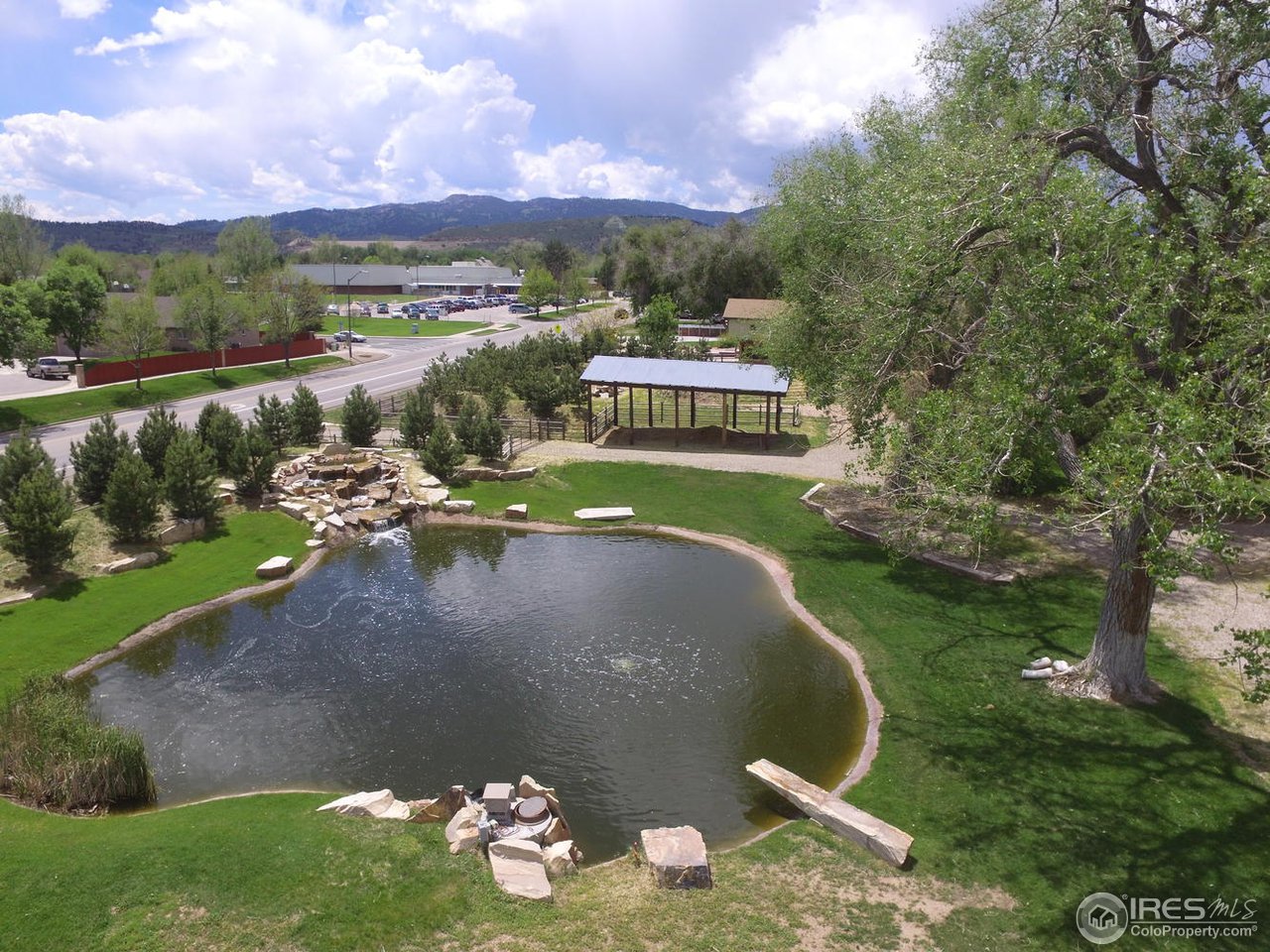 2304 West Prospect Road Fort Collins, CO 80526 - Photo 4 of 39 Large stocked pond with waterfall