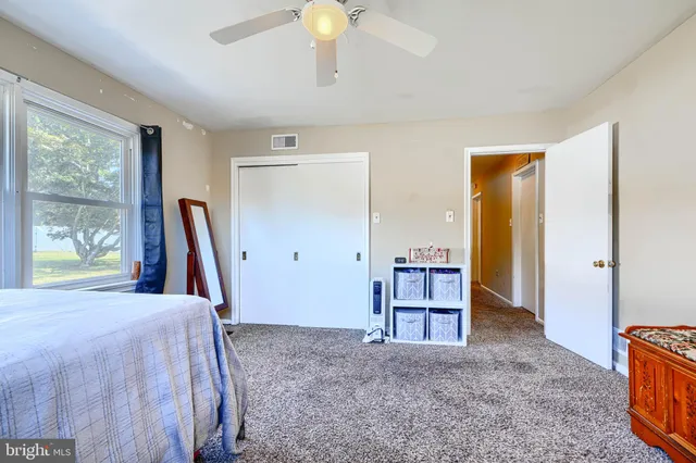 a bed room with a bed and a window