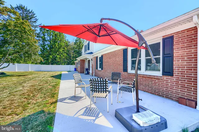 a patio with table and chairs