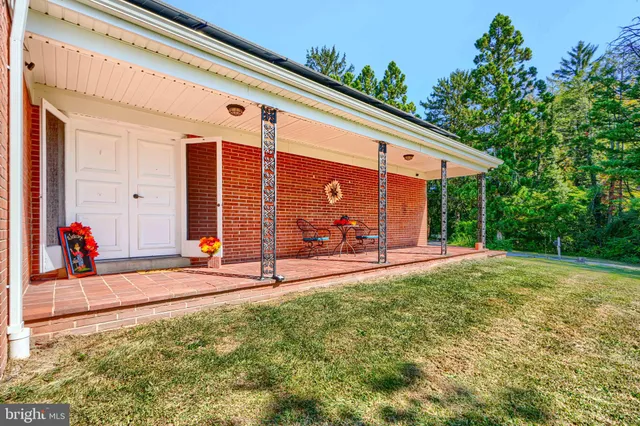 a view of a backyard with a patio
