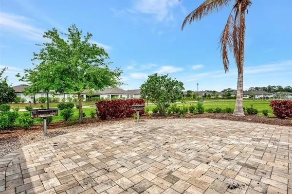 a view of a backyard with sitting area