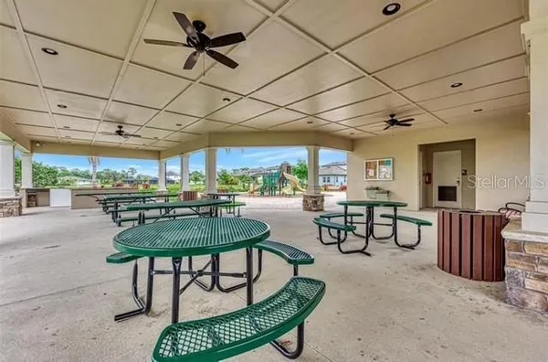 a dining room with furniture and a rug
