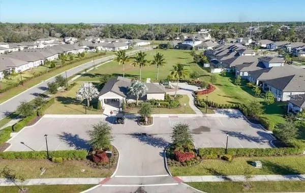 an aerial view of a house with a yard