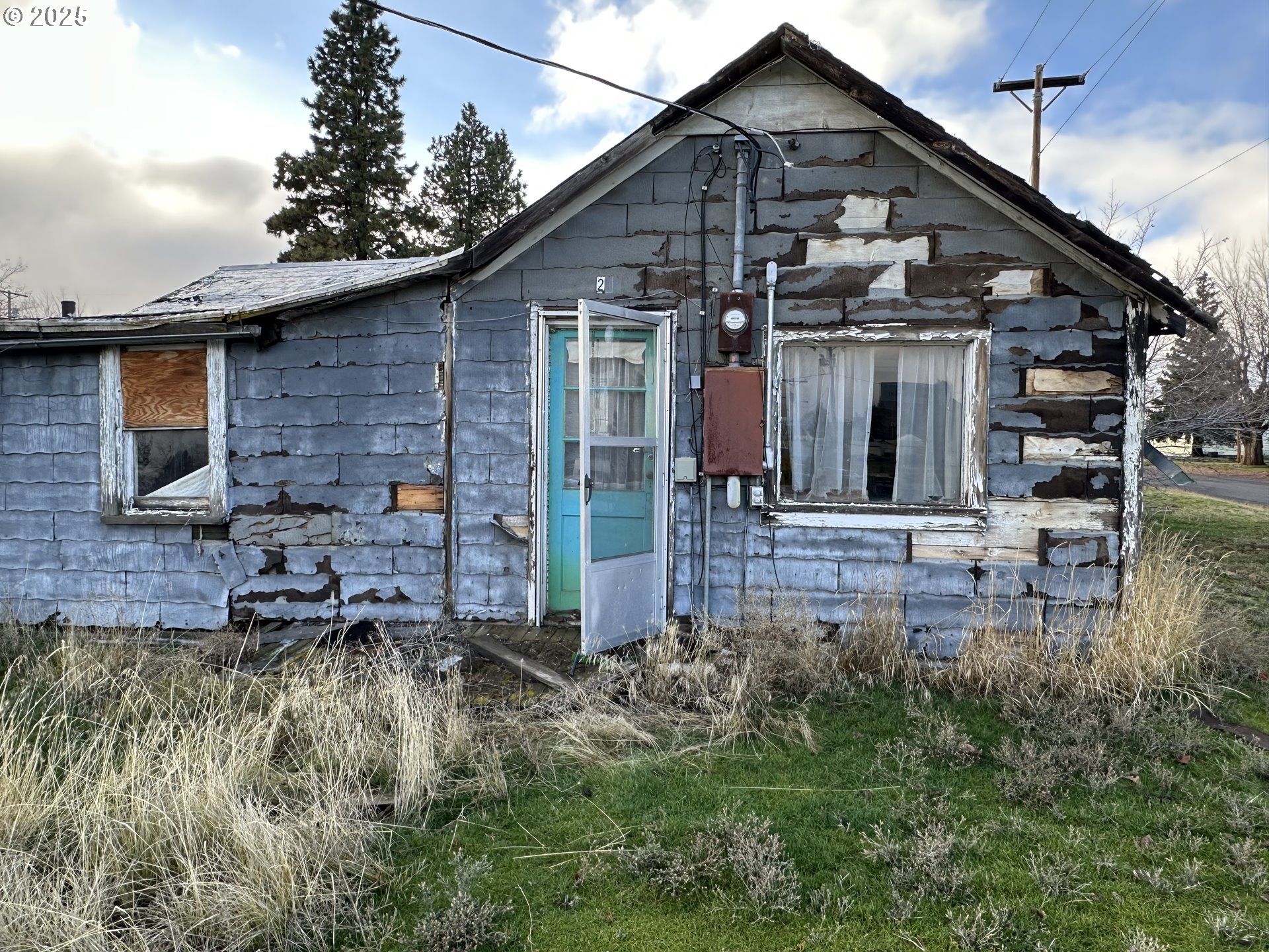 233 North Potter Street Condon, OR 97823 - Photo 1 of 1 a front view of a house with garden