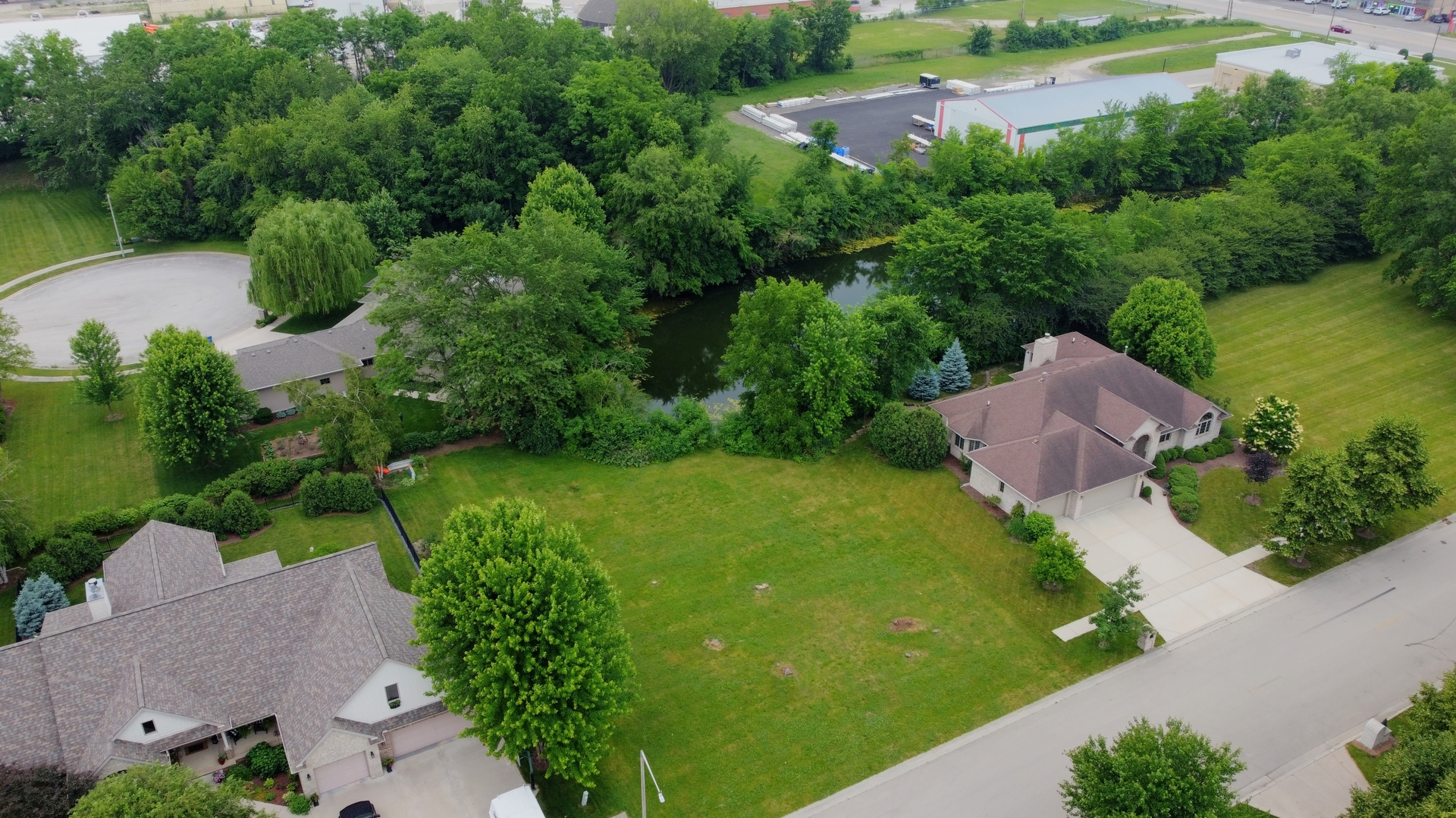 401 Jennings Drive Morris, IL 60450 - Photo 7 of 9 an aerial view of lake residential house with outdoor space and trees all around