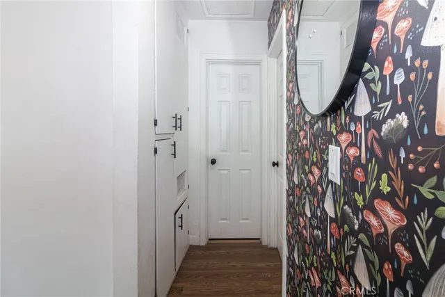 a view of an entryway with wooden floor