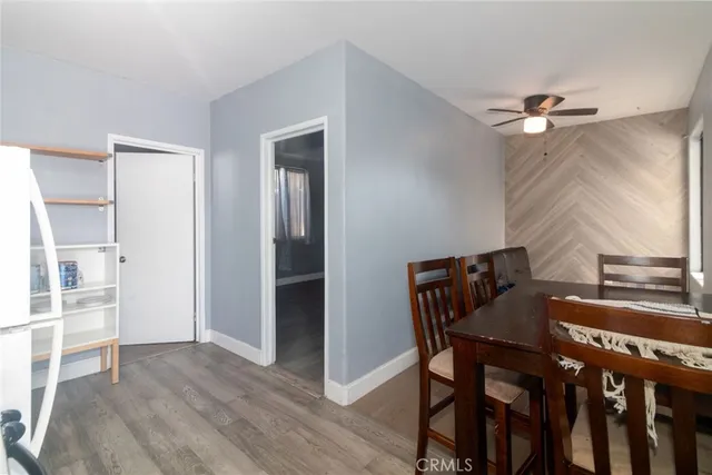 a view of a dining room with furniture and a chandelier
